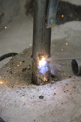 welds of a railing during the renovation of a roof in the evening in Italy