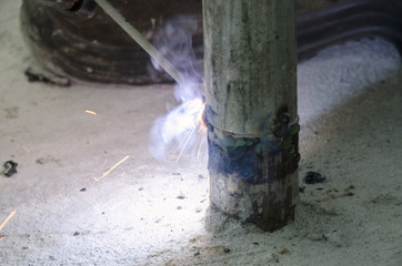 welds of a railing during the renovation of a roof in the evening in Italy