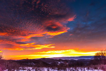 Winter red sunrise in the mountains