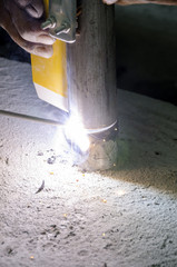welds of a railing during the renovation of a roof in the evening in Italy