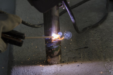 welds of a railing during the renovation of a roof in the evening in Italy