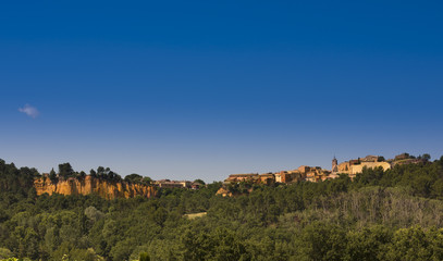 View of Roussillon with ocher cliffs. Vaucluse, Provence, France