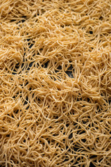 Dried egg noodles. Raw Fresh Spaghetti. Food background