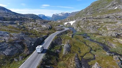 Papier Peint photo Photo aérienne Aerial view of mountain and road to Dalsnibba, travelling caravan in Norway