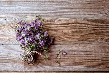  thyme  bunch onwooden  table, copy space, top view