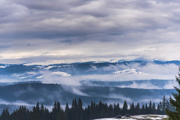 Fototapeta na wymiar Clouds in the winter tiome at Tihuta, Romania