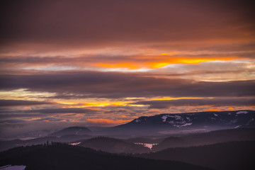 Fantastic colors of clouds at the sunset in Carpathians Mountains