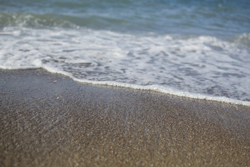 Fototapeta na wymiar background with sea waves and sand