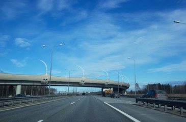 Road for cars under the blue sky