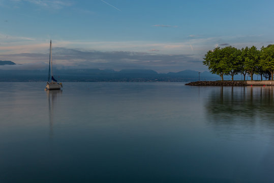 Colorful sunrise on the marina of Lausanne on the Lake Leman in summer with the view of the Swiss Alps in background - 22