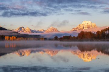 Scenic Sunrise Reflection of the Tetons in Autumn