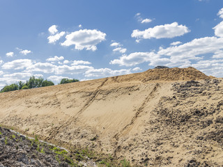 Fototapeta na wymiar mountain of sand on the construction site