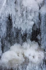 Icicles on the rocks inside of the forest