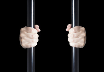Male hands holding prison bars