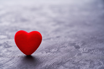 Fototapeta premium Red heart on black background