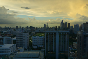 Storm clouds with rain passing over sky of Bangkok cityscape. 4K Timelapse