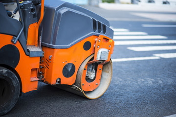 Close view on the road roller working on the new road construction site.repair