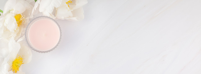 White peony flowers on marble background