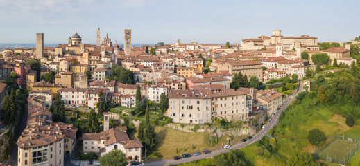 Fototapeta na wymiar Drone aerial view of Bergamo - Old city. One of the beautiful town in Italy. Landscape to the city center and its historical buildings