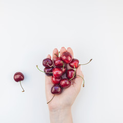 Fresh ripe cherry in a female hands