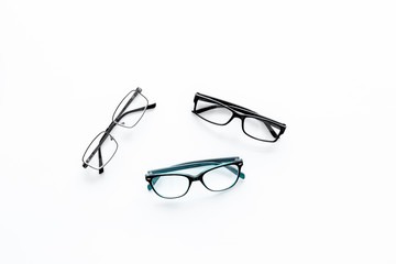 Glasses concept. Set of glasses with different eyeglass frame and transparent lenses on white...