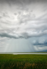 Thunderstorm Downpour. Storm clouds and rain over the Fraser River and the Vancouver Airport.

