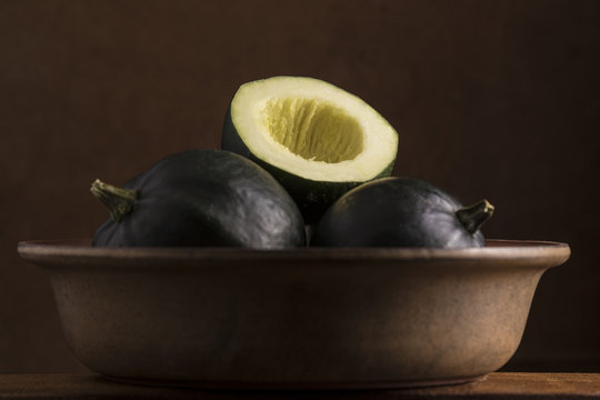 Gem squash placed in a brown bowl