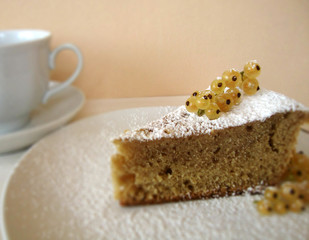 berry pie. piece of cake. white currant. cake. powdered sugar. Breakfast with a piece of cake and tea.