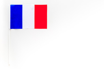 French flag concept. small flag on white background top view copy space