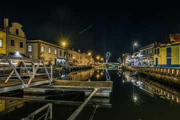 Night canal in Aveiro. Portuguese Venice. Reflection.