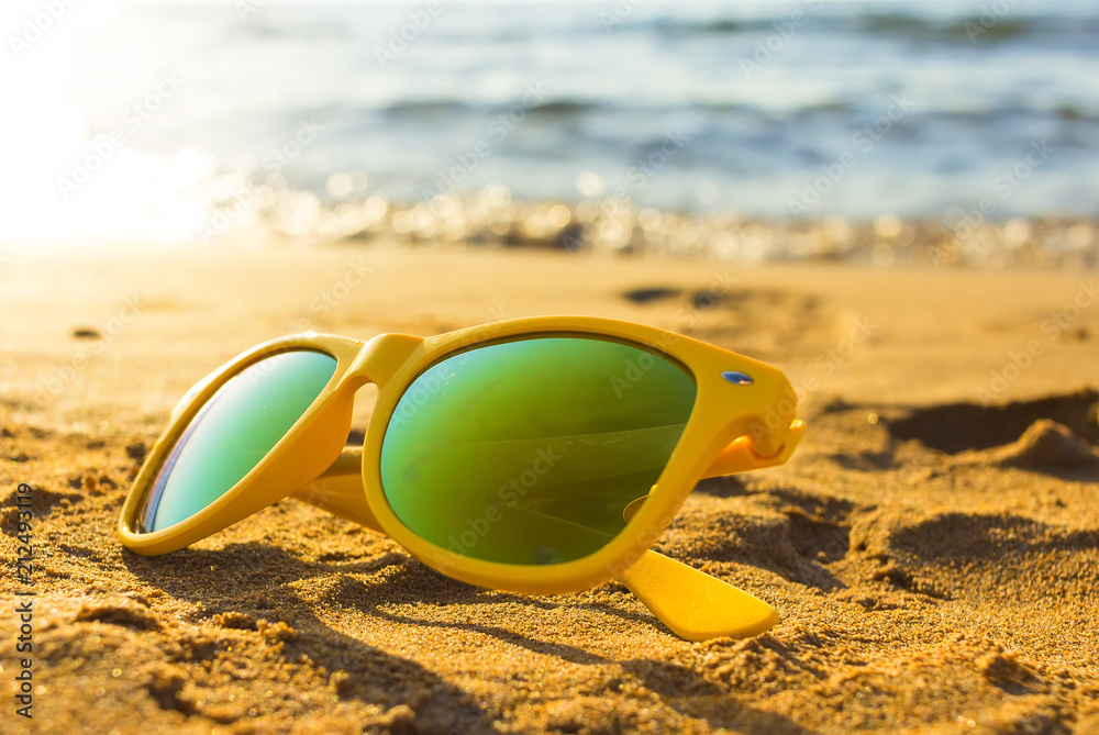 Wall mural sunglasses on the tropical beach. travel relax vacation - azure sea, white sand, shining sun, summer