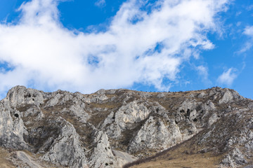 Mountains stone and white clouds