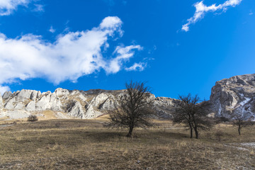 Mountains stone and white clouds