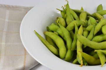 Soy beans in a white bowl