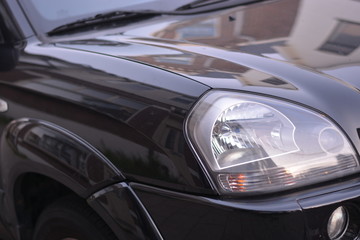 Fototapeta na wymiar Headlights on a black car