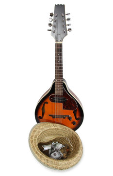 Mandolin and other things of a strolling musician on a white background