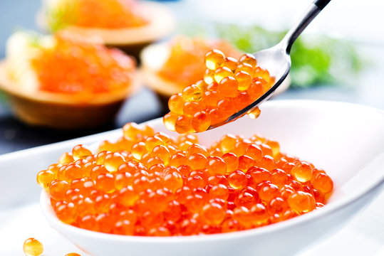Caviar. Salmon caviar in a bowl. Closeup trout caviar. Gourmet food. Seafood.