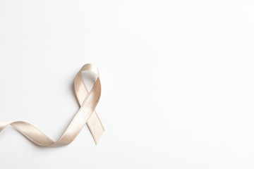 Grey ribbon on white background, top view. Cancer awareness