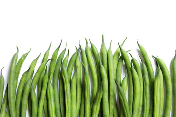 Fresh green French beans on white background