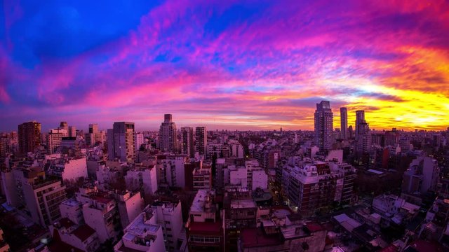 Time-lapse view on the skyline of the city as colorful clouds pass by in the light of the setting sun in Buenos Aires, Argentina.
