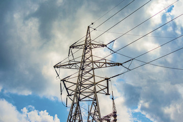 High-voltage wires on poles under high voltage. Tinted image. Power plants on the industry.