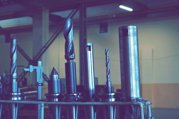 Cutting tools on the rack and ready-to-operate cnc-machining with a quick cut and taps.