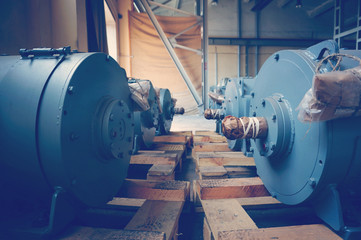 New electric motors of gray color of high power are in stock and ready for use.