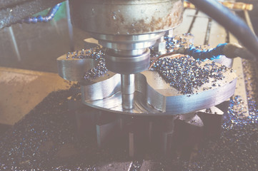 The milling cutter on the CNC machine processes the gear tooth