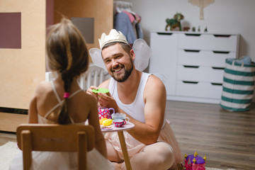 Little daughter and father have fun, dressing in princess costume, daddy makeup © rastlily
