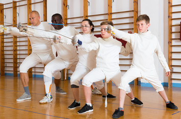 Portrait of glad mixed age group of athletes