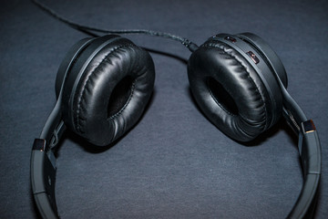 accessory,audio,background,black,cable,desk,device,digital,dj,earphone,equipment,gadget,head,headphone,headphones,headset,isolated,modern,music,nobody,object,sound,stereo,studio,table,technology,top,v