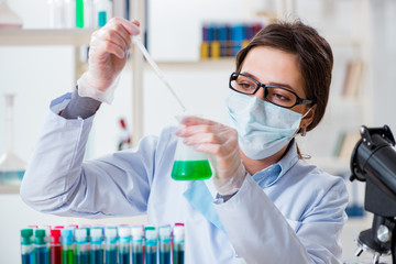 Female chemist working in hospital lab