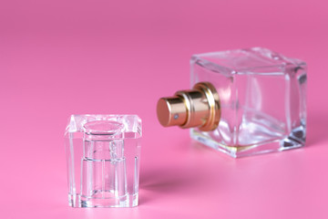 A glass perfume bottle, a female fragrance, an accessory for beauty