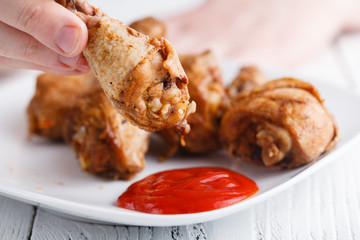 senior man eating fried chicken leg